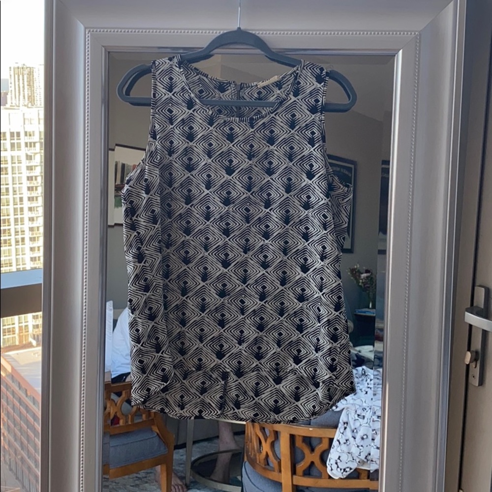 White and black graphic sleeveless blouse.